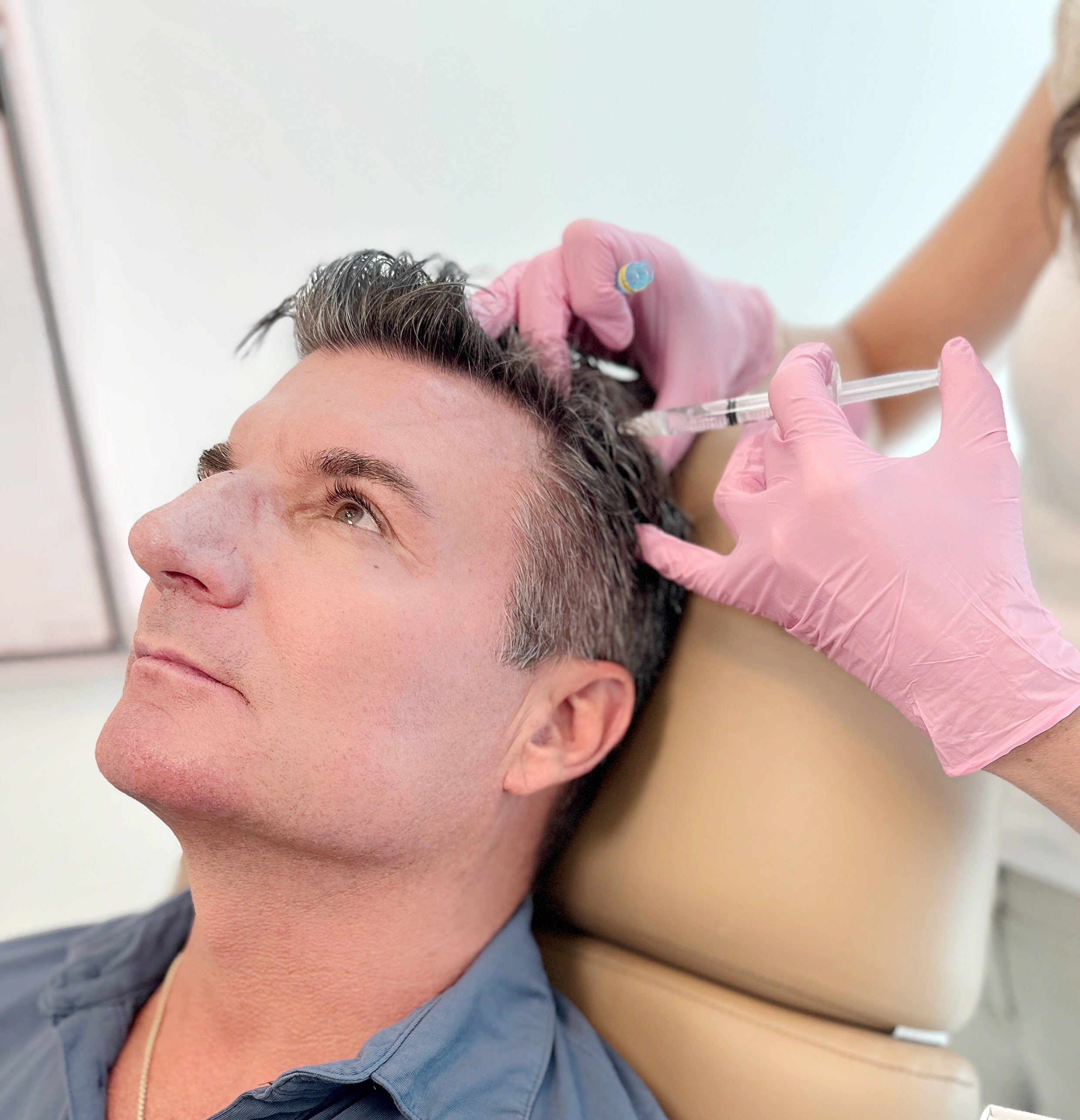 Patient receiving hair restoration treatment at Meg Fox Aesthetics