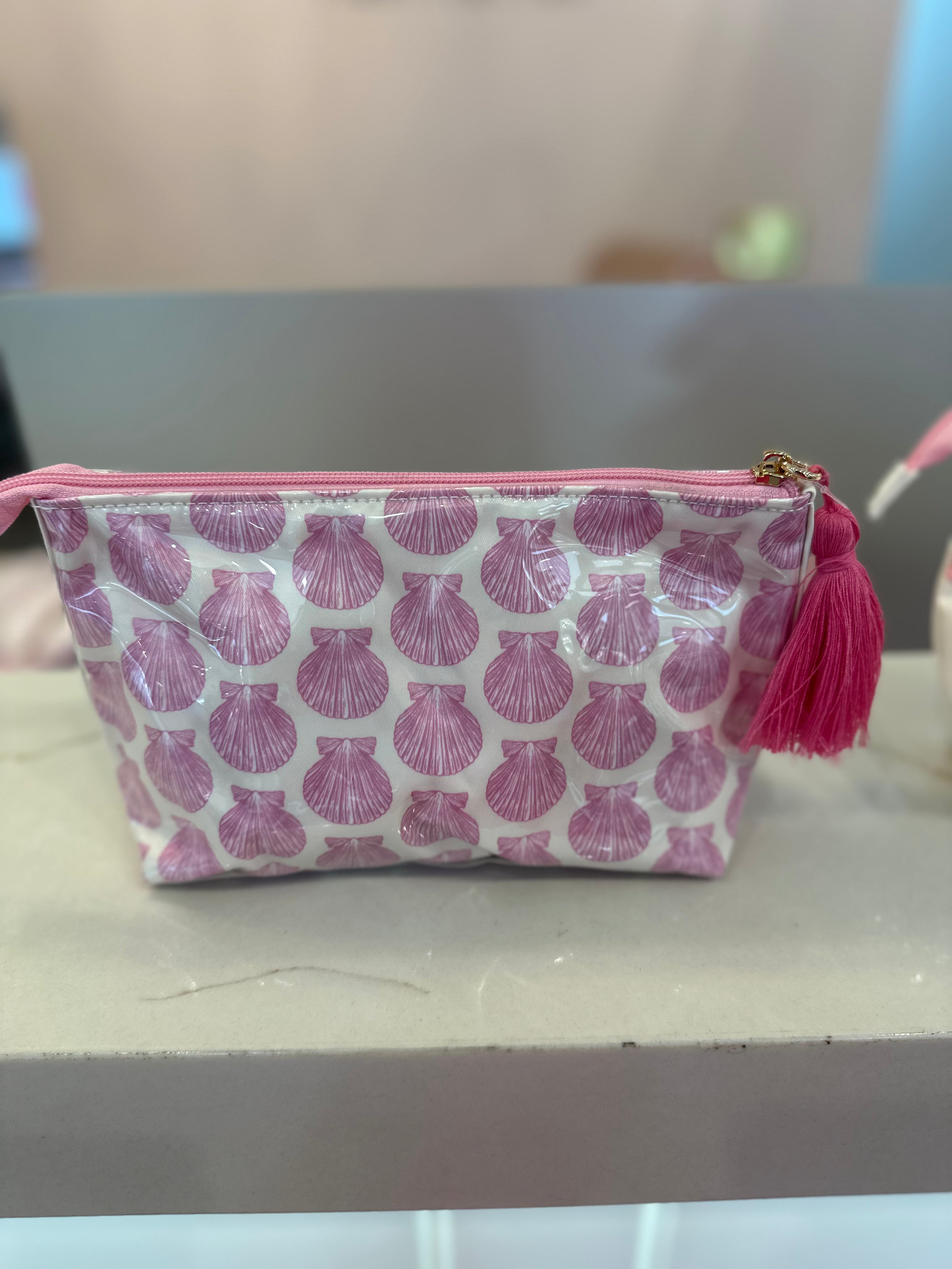 Clearcoat seashell cosmetic pouch