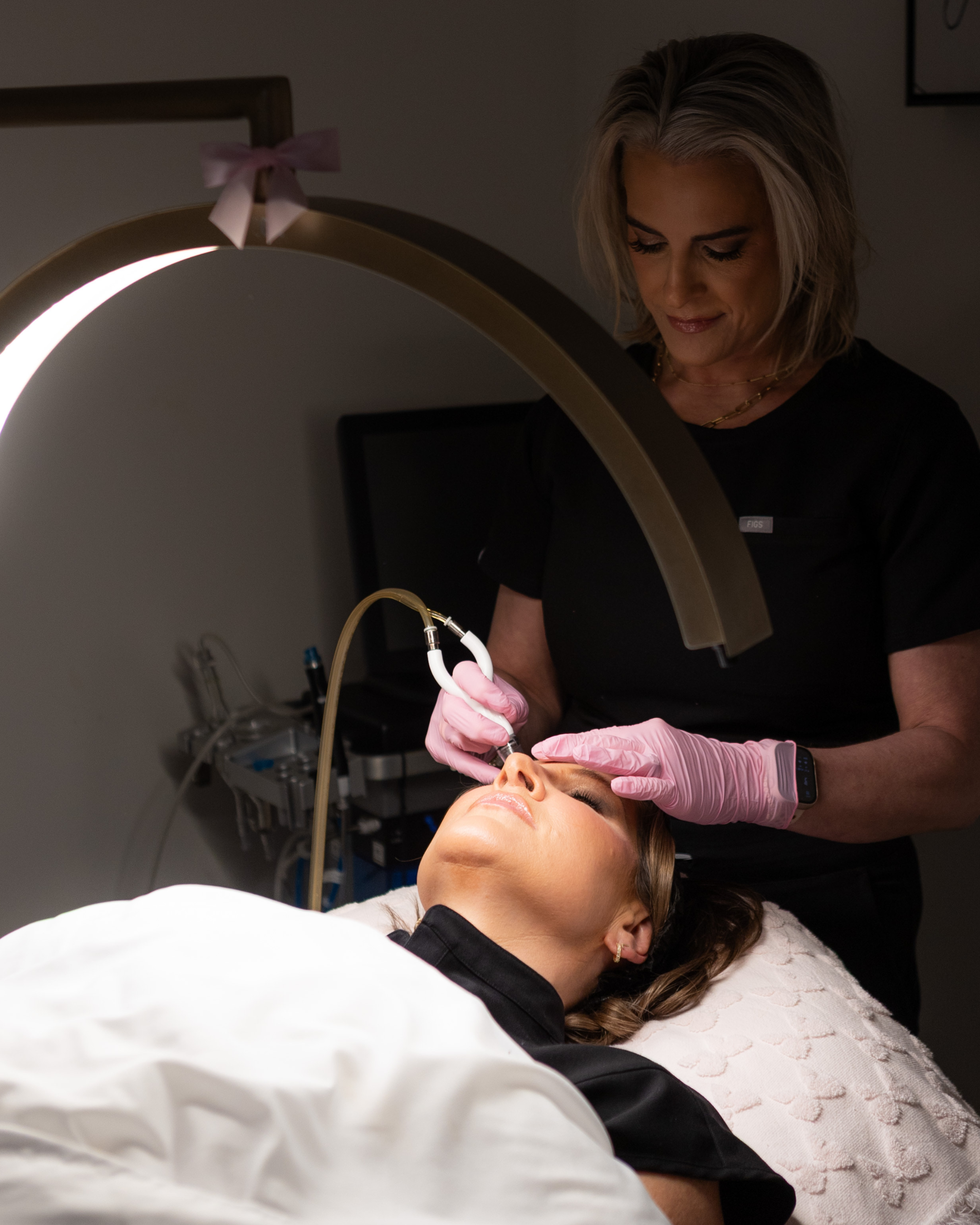 client receiving diamond glow treatment in towson